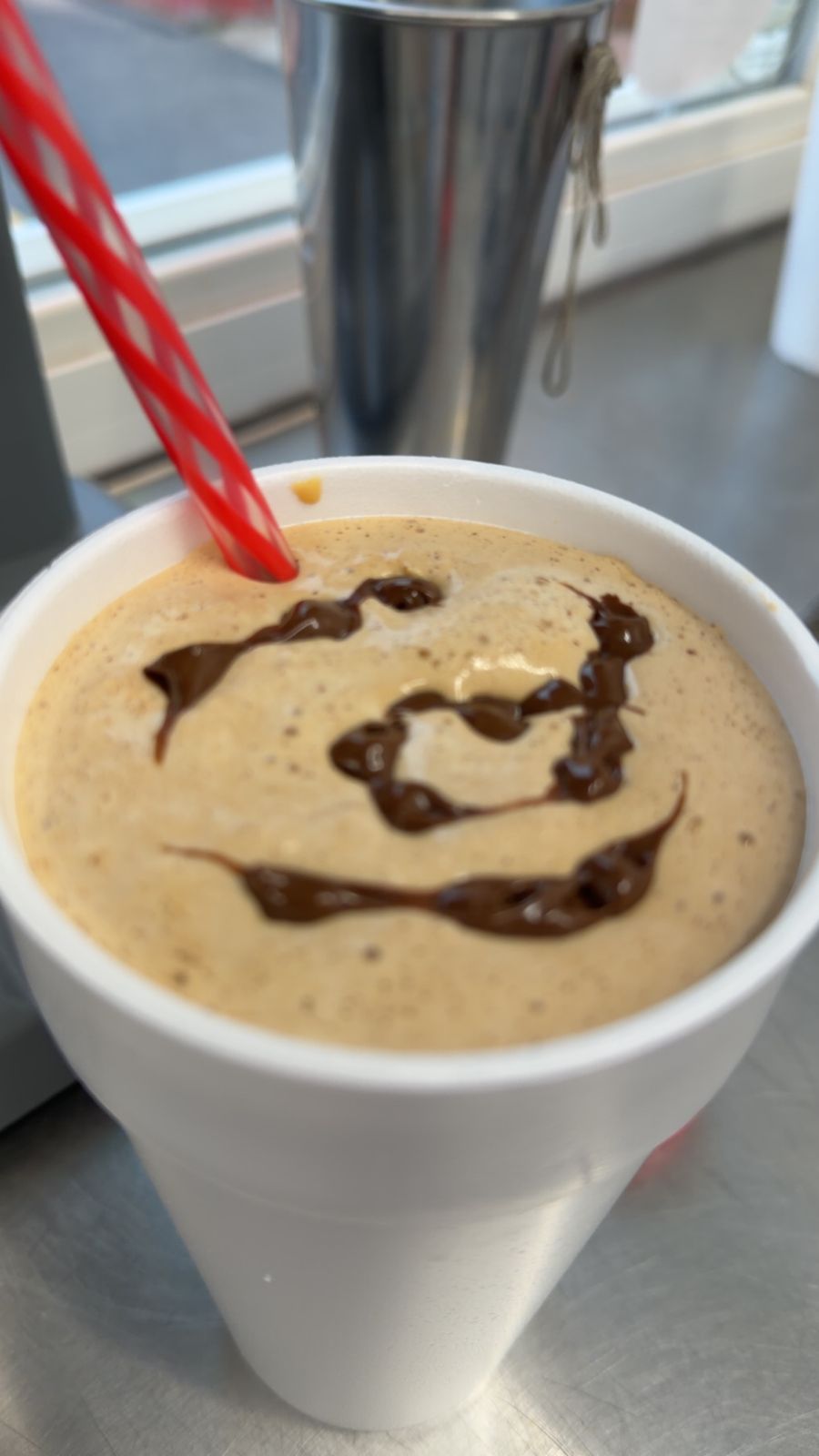 Milkshake with chocolate drizzle